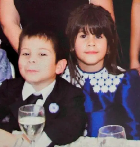 A photo of me and my sister dressed elegantly.